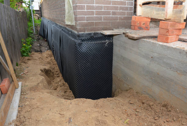 Happy homeowners after waterproofing job in Mansfield